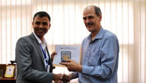 HERD executive director Dr Sushil Baral (left) accepts the award from Dr Frank Paulin, acitng WHO representative, Nepal